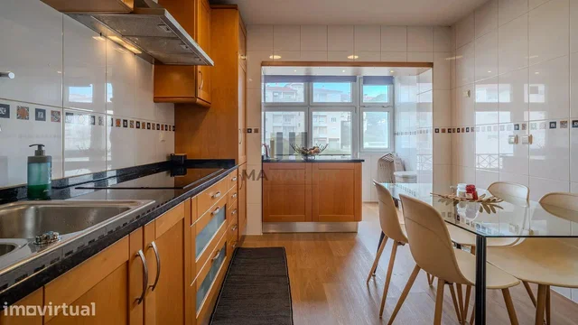 Kitchen; kitchen appliances, wood floor, natural light