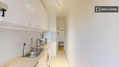 Kitchen; kitchen appliances, tile floor, natural light