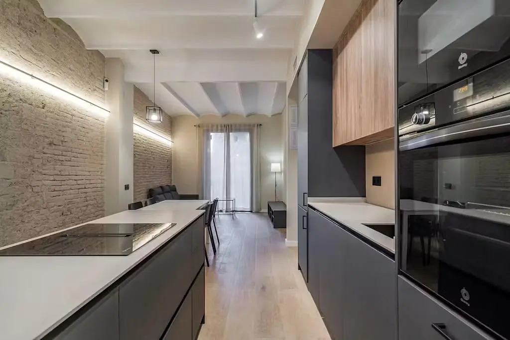 Kitchen; kitchen appliances, wood floor, renovated, natural light