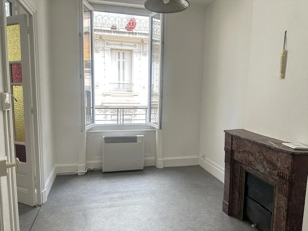 Living room; fireplace, natural light, needs renovation