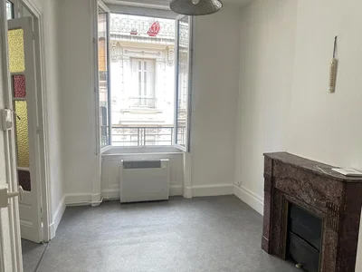 Living room; fireplace, natural light, needs renovation