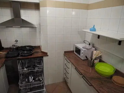 Kitchen; kitchen appliances, tile floor, needs renovation