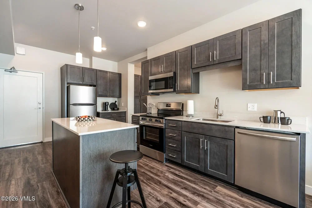 Kitchen; kitchen appliances, wood floor, tile floor, renovated, natural light