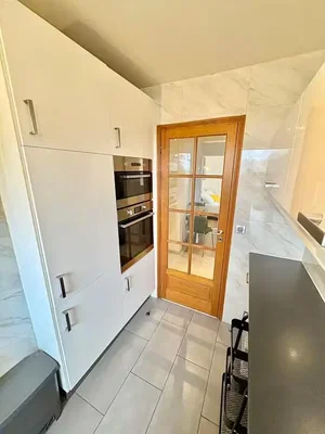 Kitchen; kitchen appliances, tile floor, renovated, natural light