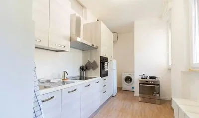 Kitchen; kitchen appliances, wood floor, natural light