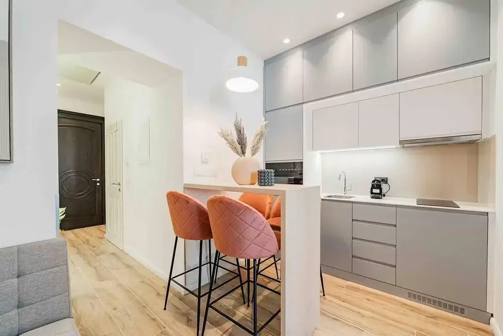 Kitchen; kitchen appliances, wood floor, renovated, natural light