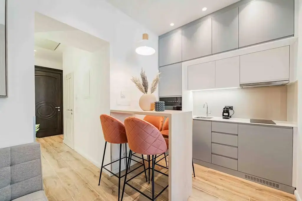 Kitchen; kitchen appliances, wood floor, renovated, natural light