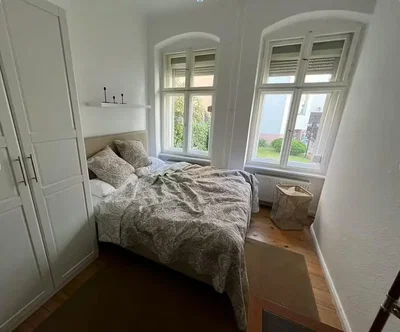 Bedroom; natural light, wood floor