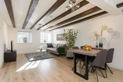 Living room; wood beams, wood floor, natural light