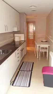 Kitchen; kitchen appliances, tile floor, natural light