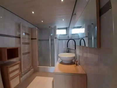 Bathroom; tile floor, wood beams, renovated, natural light