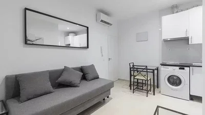 Living room; kitchen appliances, natural light