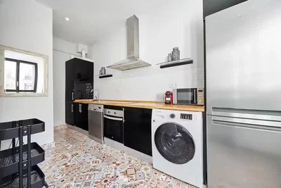 Kitchen; kitchen appliances, tile floor, natural light