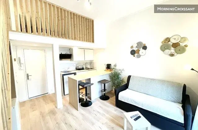 Living room; kitchen appliances, wood floor, natural light, modern style