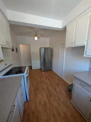 Kitchen; kitchen appliances, wood floor, natural light