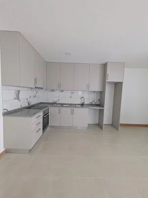 Kitchen; kitchen appliances, tile floor, renovated, natural light