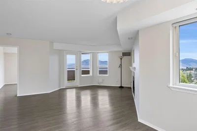 Living room; natural light, wood floor, high ceiling, view