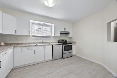 Kitchen; kitchen appliances, tile floor, natural light, modern style, renovated