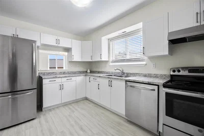 Kitchen; kitchen appliances, tile floor, natural light, renovated
