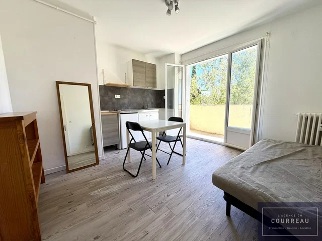 Kitchen; kitchen appliances, wood floor, natural light, view