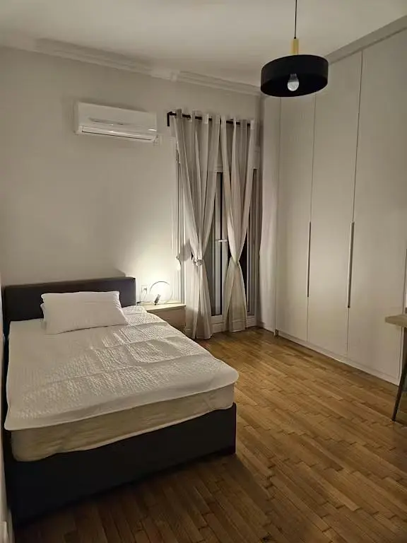 Bedroom; wood floor, natural light