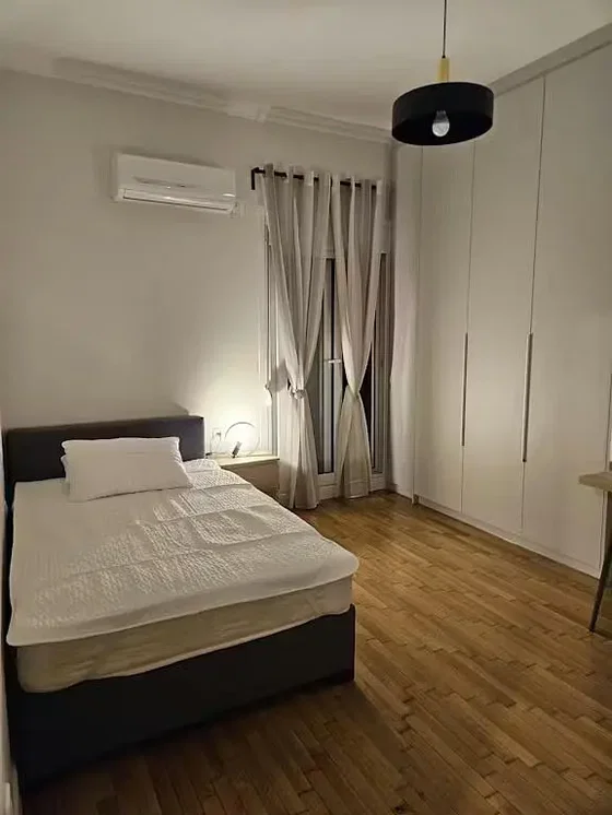 Bedroom; wood floor, natural light