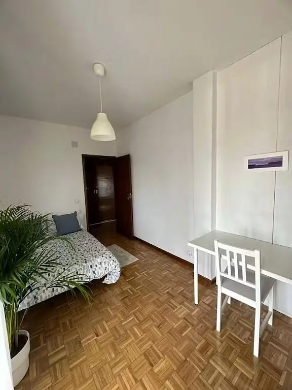 Bedroom; wood floor, natural light