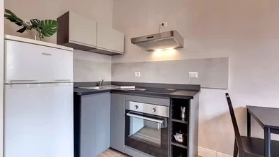 Kitchen; kitchen appliances, tile floor, natural light