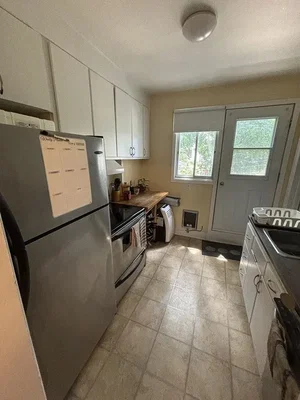 Kitchen; tile floor, kitchen appliances, natural light