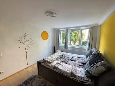 Bedroom; natural light, wood floor