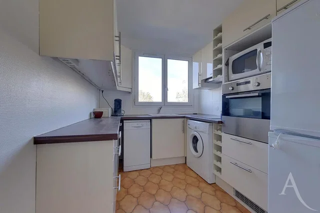 Kitchen; kitchen appliances, tile floor, natural light