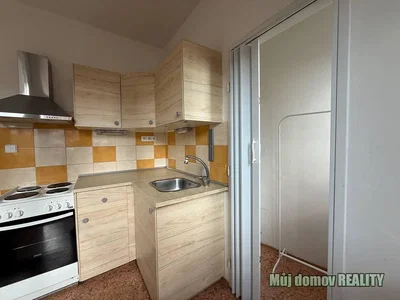 Kitchen; kitchen appliances, tile floor, needs renovation