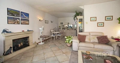 Living room; fireplace, tile floor, natural light