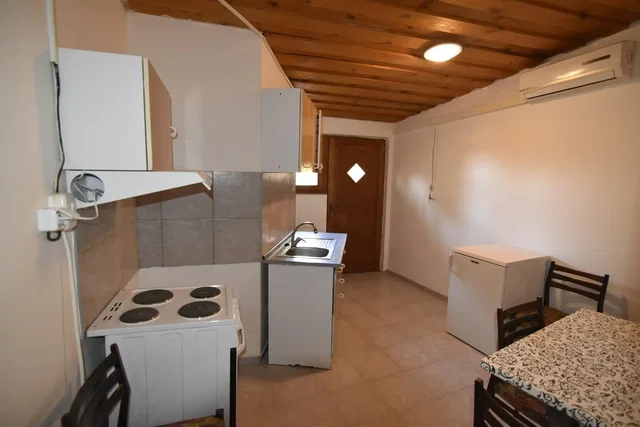 Kitchen; kitchen appliances, wood beams, tile floor