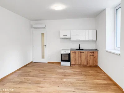 Kitchen; kitchen appliances, wood floor, natural light
