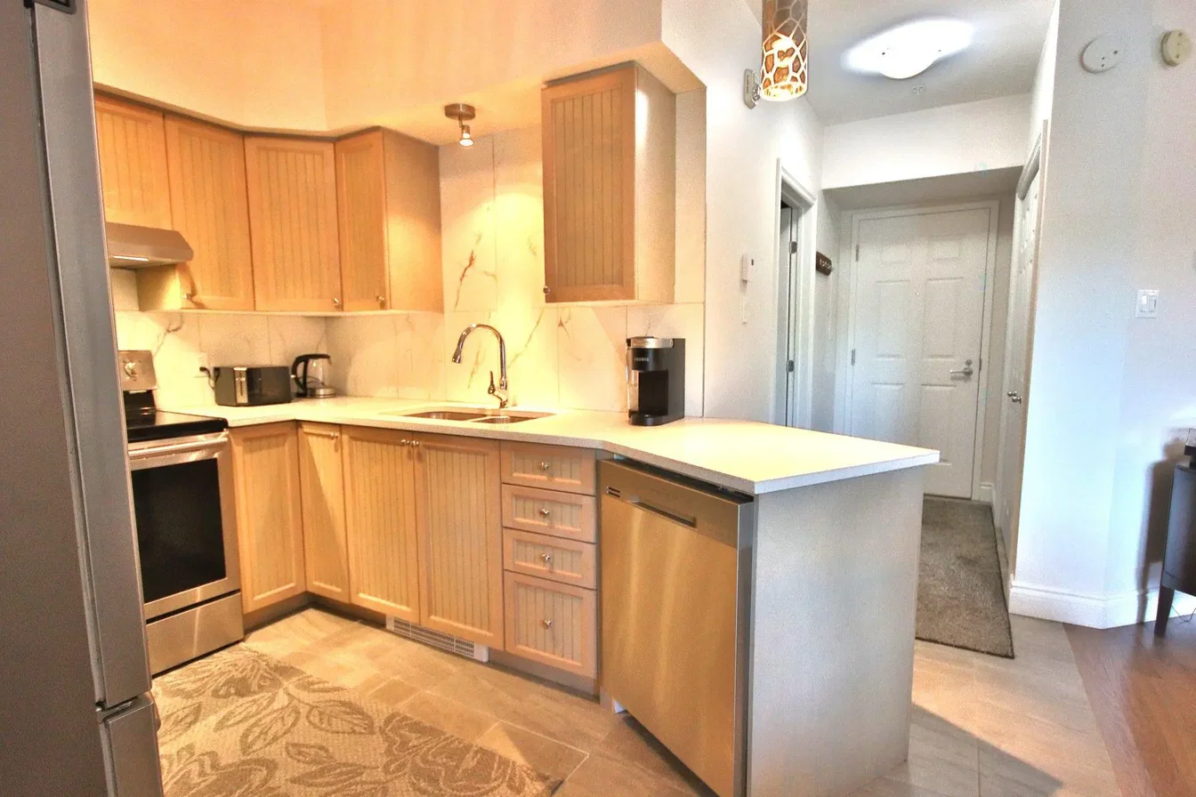 Kitchen; kitchen appliances, tile floor, natural light
