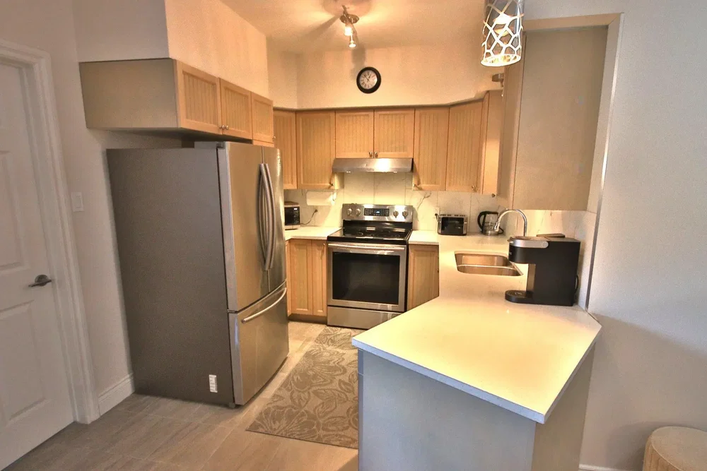 Kitchen; kitchen appliances, tile floor, natural light