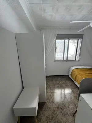 Bedroom; tile floor, natural light