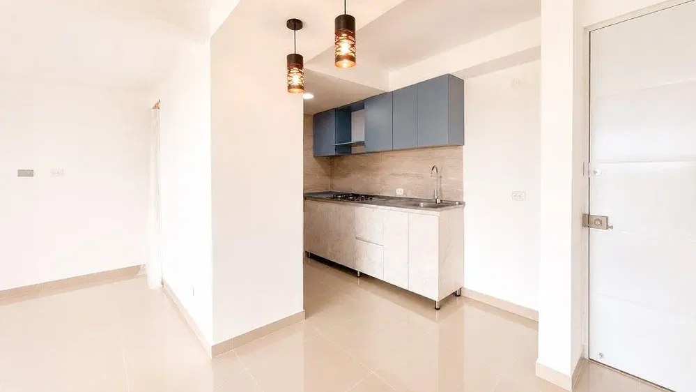 Kitchen; kitchen appliances, natural light, tile floor