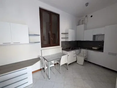 Kitchen; tile floor, kitchen appliances, natural light