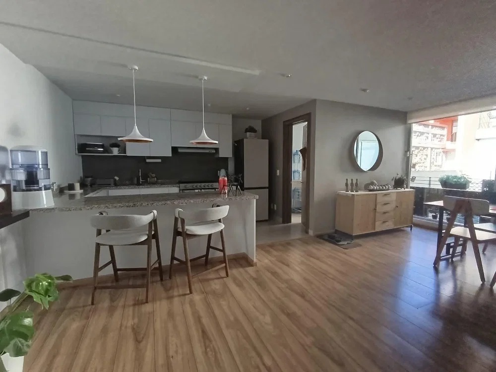 Kitchen; kitchen appliances, wood floor, natural light