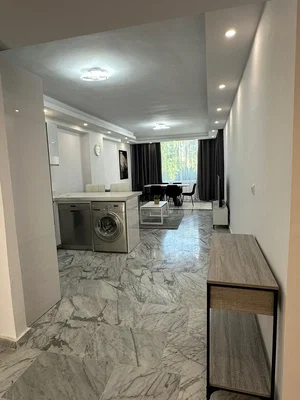 Kitchen; kitchen appliances, tile floor, natural light