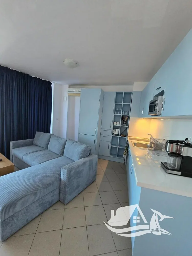 Living room; tile floor, kitchen appliances