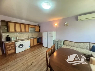 Kitchen; kitchen appliances, wood floor, natural light
