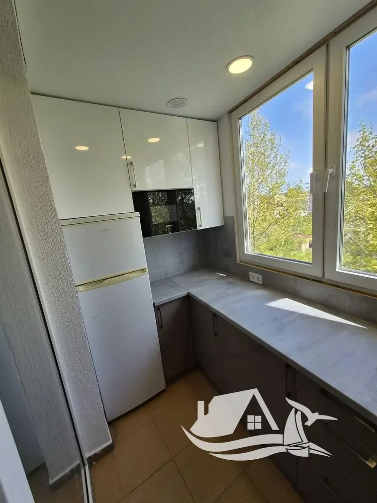 Kitchen; kitchen appliances, view, natural light, tile floor