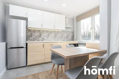 Kitchen; kitchen appliances, tile floor, natural light