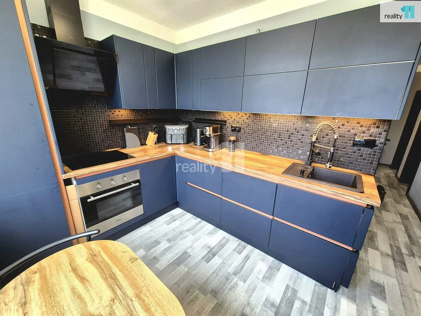 Kitchen; kitchen appliances, wood floor, tile floor, renovated, natural light