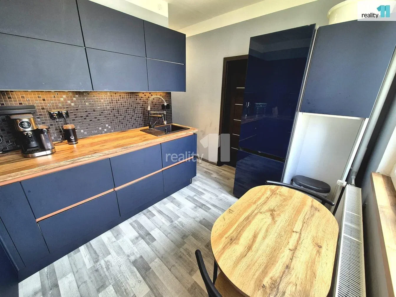 Kitchen; wood floor, tile floor, kitchen appliances, natural light
