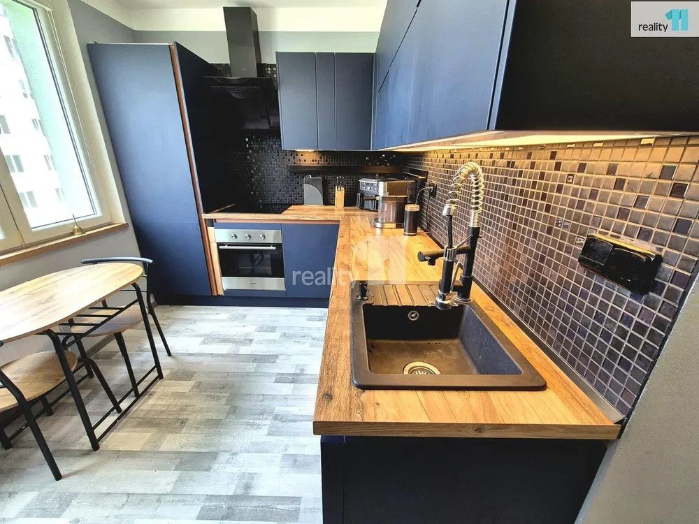 Kitchen; kitchen appliances, wood floor, tile floor, natural light