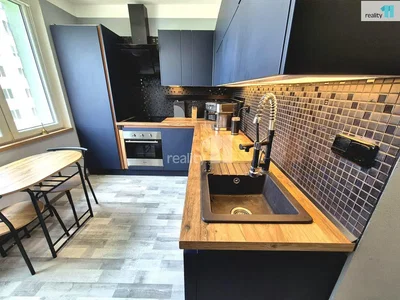 Kitchen; kitchen appliances, wood floor, tile floor, natural light
